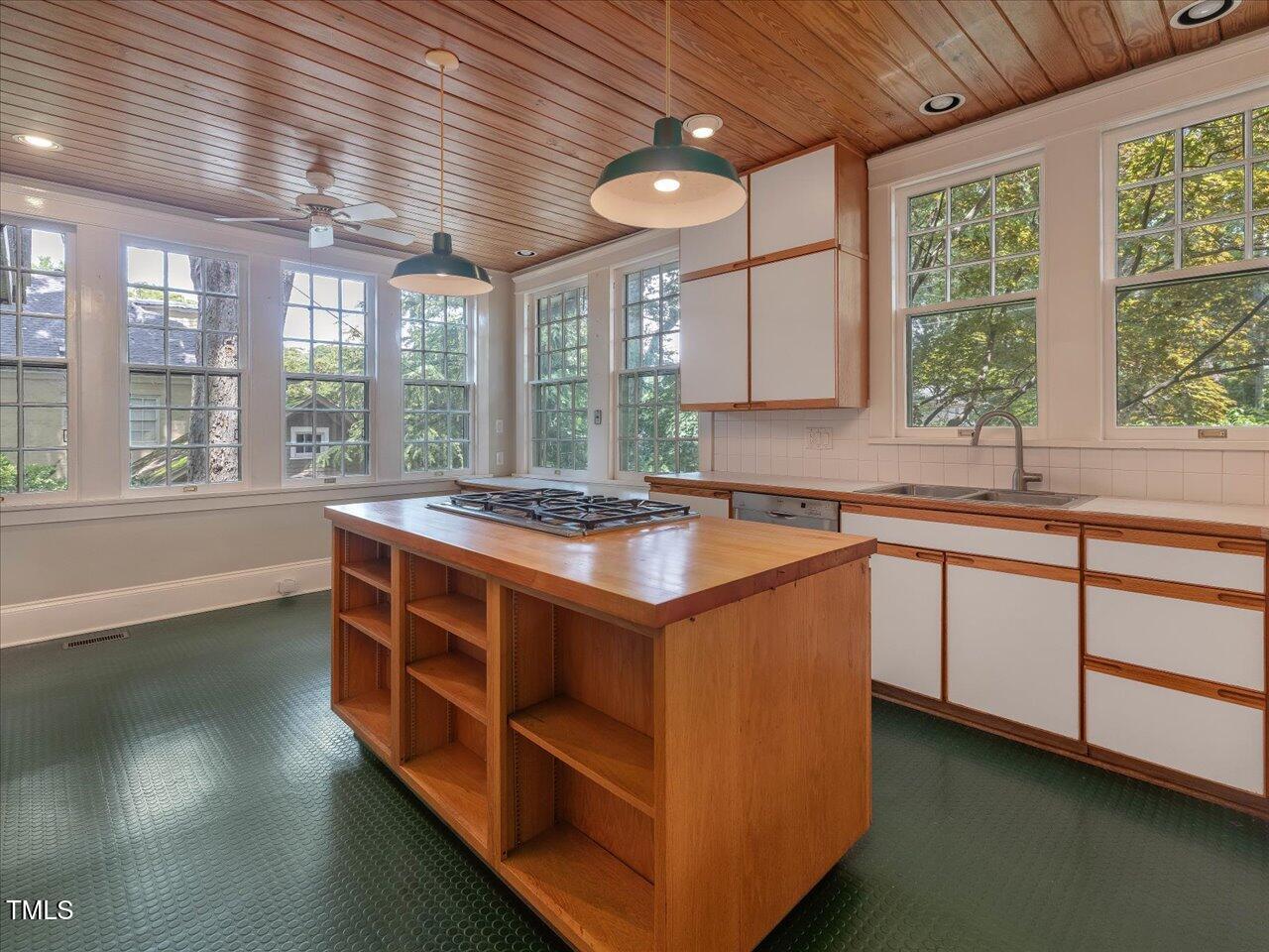 2400 Fairview Road Raleigh, NC 27608 - Photo 47 of 94 a kitchen with stainless steel appliances granite countertop a sink and a large window