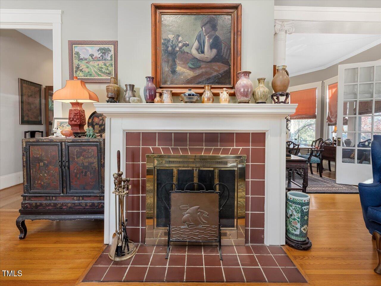 2400 Fairview Road Raleigh, NC 27608 - Photo 5 of 94 a living room with furniture a flat screen tv and a fireplace