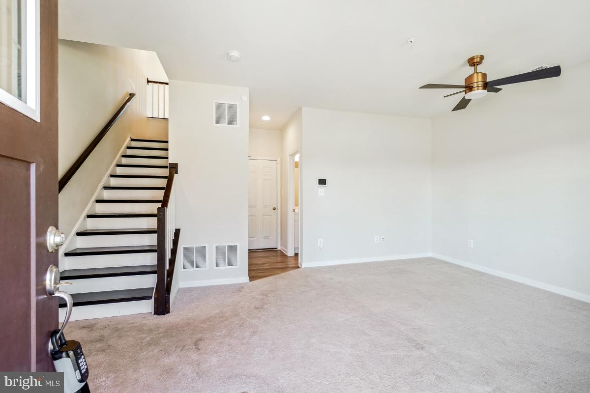 5820 Imperial Drive Frederick, MD 21703 - Photo 3 of 30 a view of a room with stairs and white walls