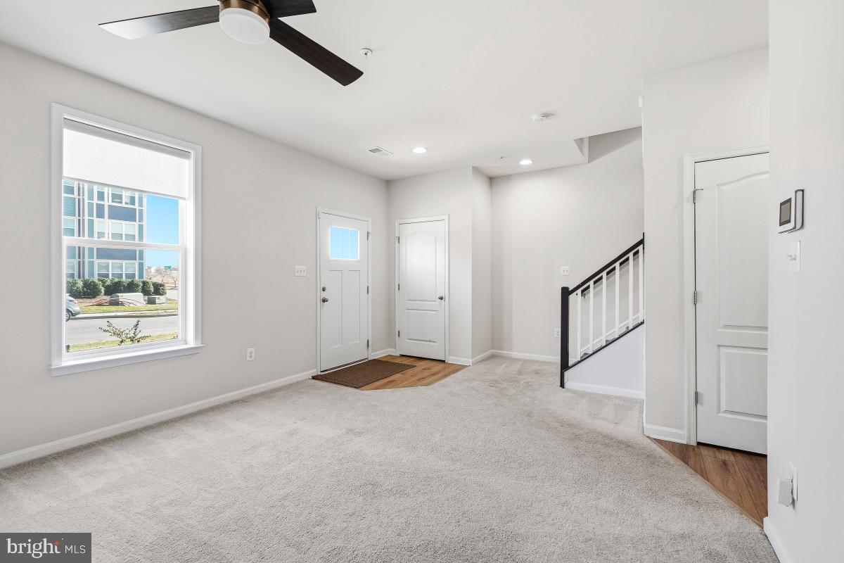 5820 Imperial Drive Frederick, MD 21703 - Photo 5 of 30 a view of an empty room with a window