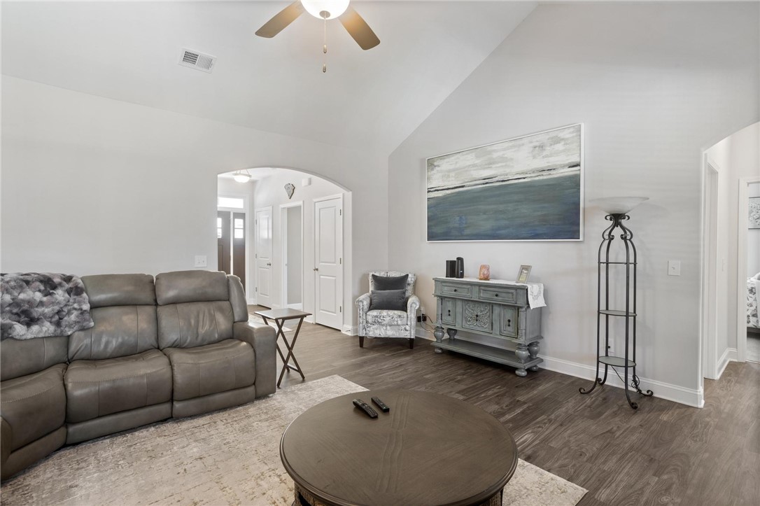125 Estateside Drive Anderson, SC 29621 - Photo 26 of 37 Cathedral ceilings enhance the spacious, naturally illuminated living area with rich wood flooring.
