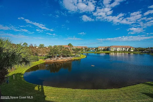 a view of a lake with a yard