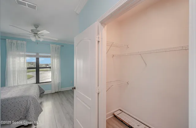 a building outdoor space with patio furniture and potted plants