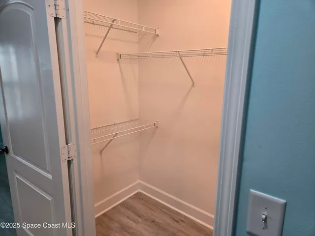 a view of a chairs and table in patio with a lake view