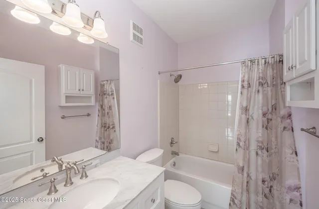 a view of a livingroom with furniture hardwood floor and a window