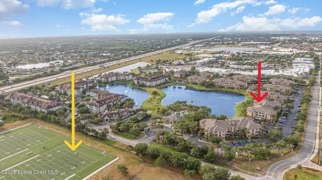 a sign broad in front of flowers