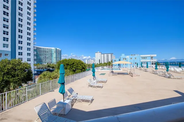 a view of a balcony with wooden floor