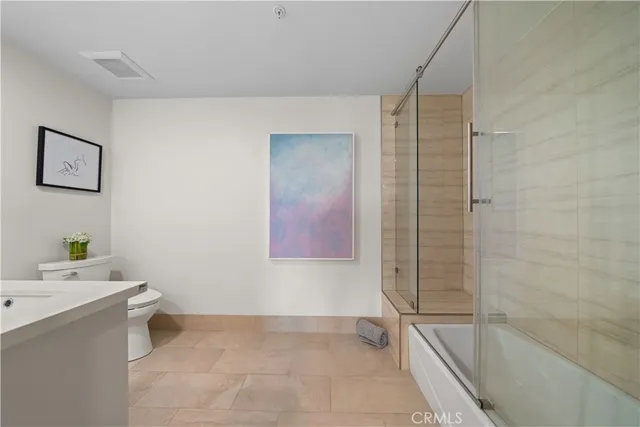 a bathroom with a bathtub and sink