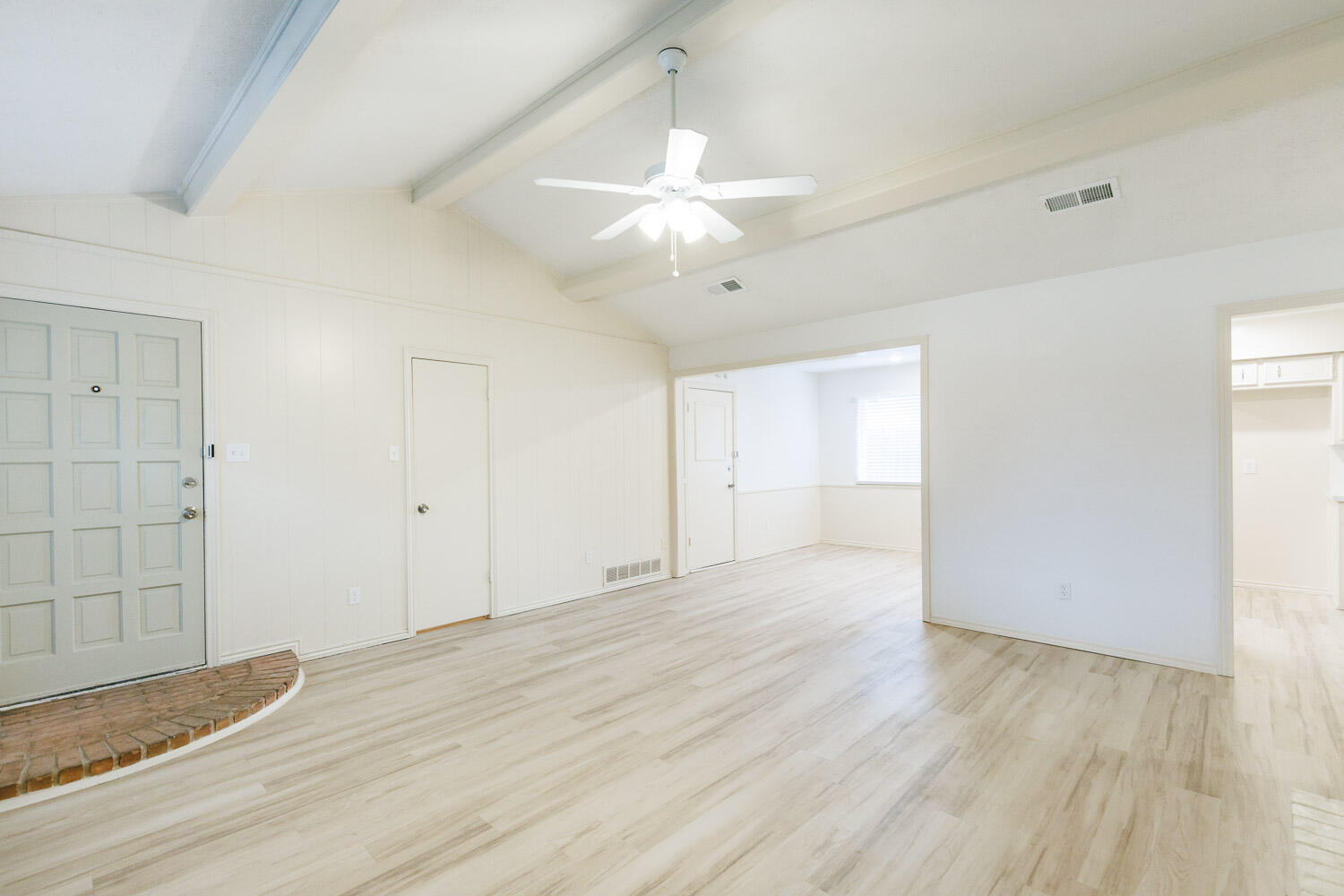 4407 75th Drive, Unit B Lubbock, TX 79424 - Photo 5 of 20 an empty room with wooden floor and ceiling fan