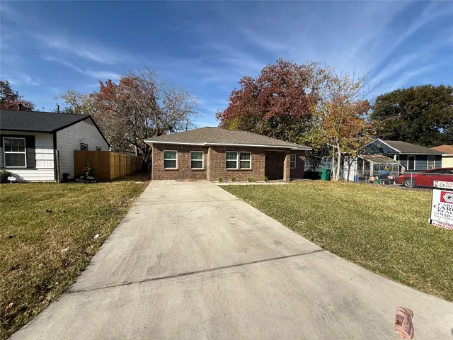 a view of house with yard