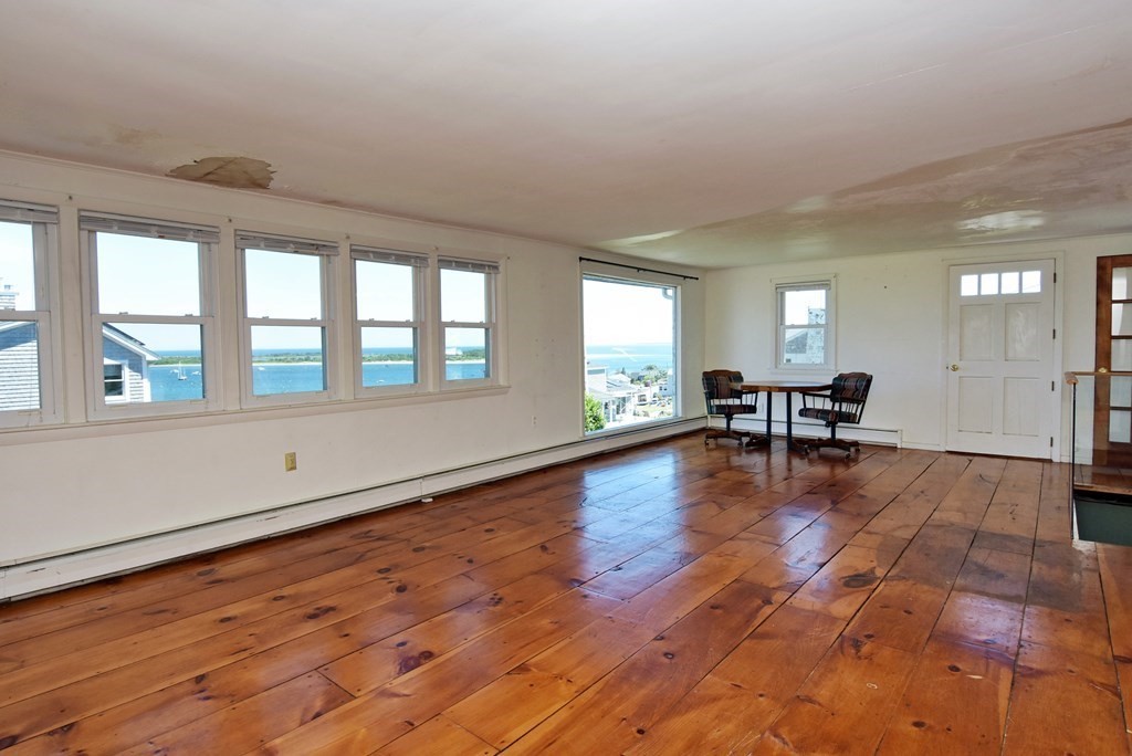 34 Appomattox Road Ipswich, MA 01938 - Photo 8 of 28 a view of an empty room with window and wooden floor