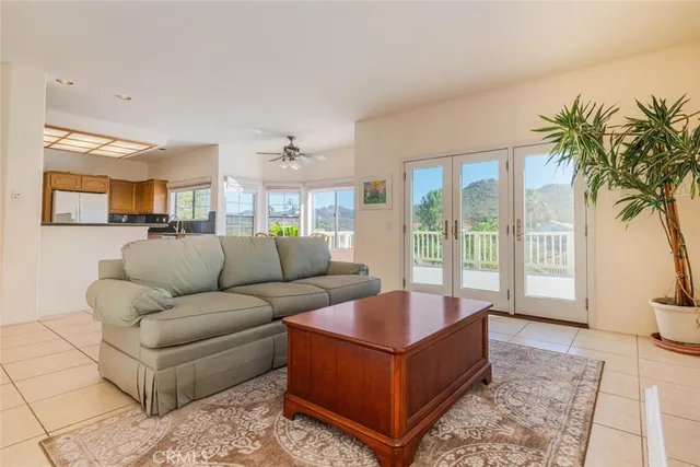 a spacious bedroom with a bed and a large window