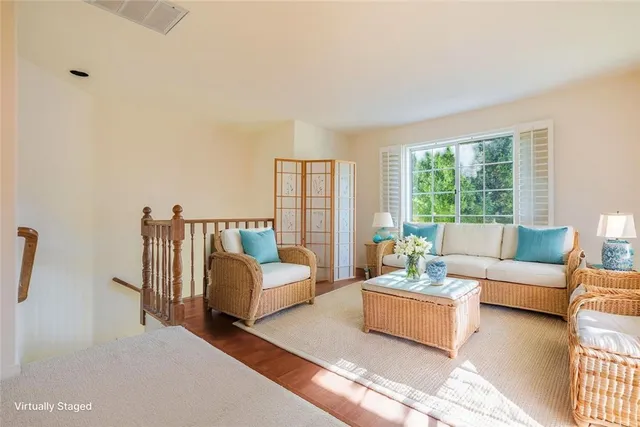 a bedroom with a bed and a potted plant