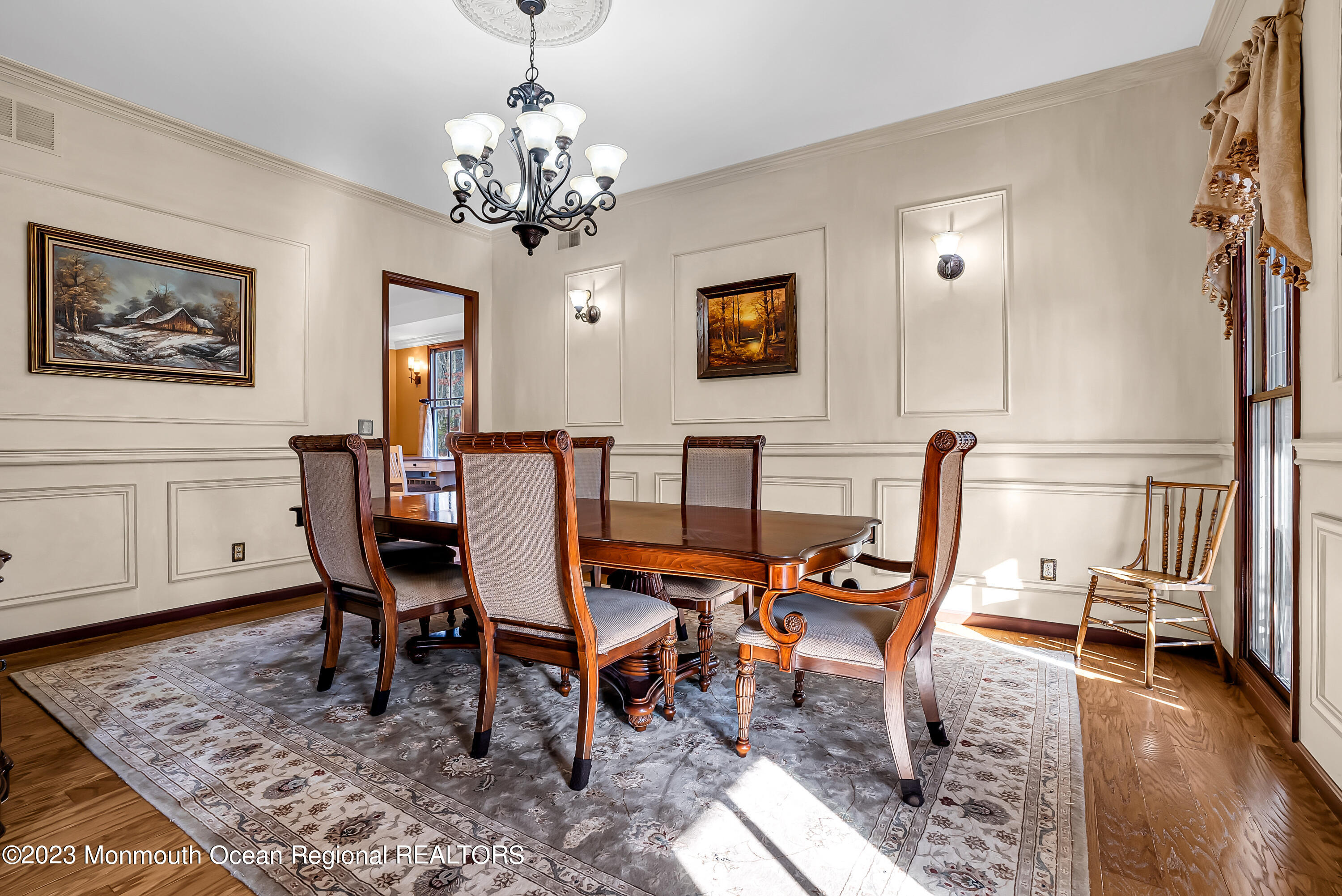 13 Pine Drive Millstone Township, NJ 08510 - Photo 26 of 56 a view of a dining room with furniture wooden floor and a chandelier