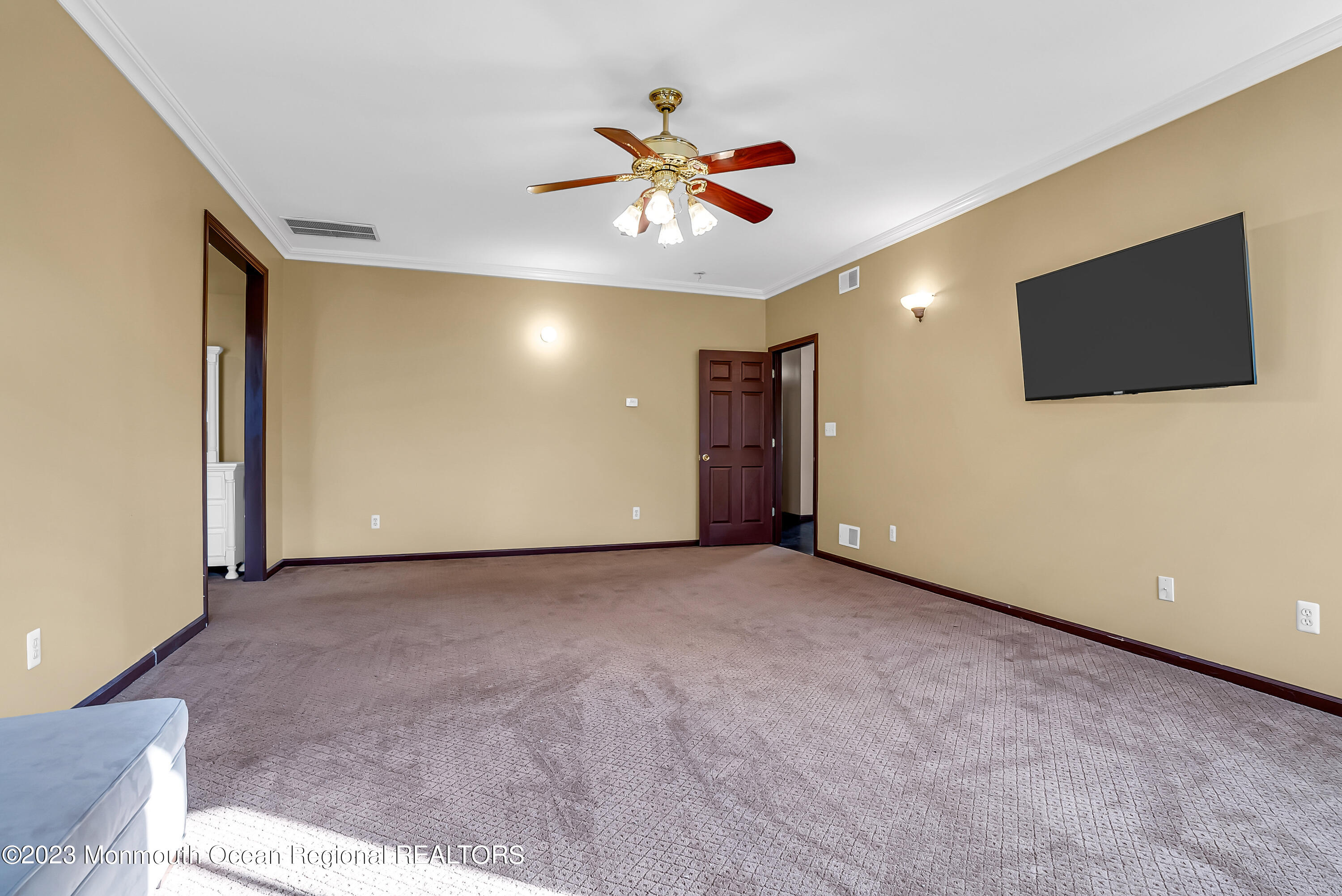 13 Pine Drive Millstone Township, NJ 08510 - Photo 35 of 56 a view of an empty room with a ceiling fan