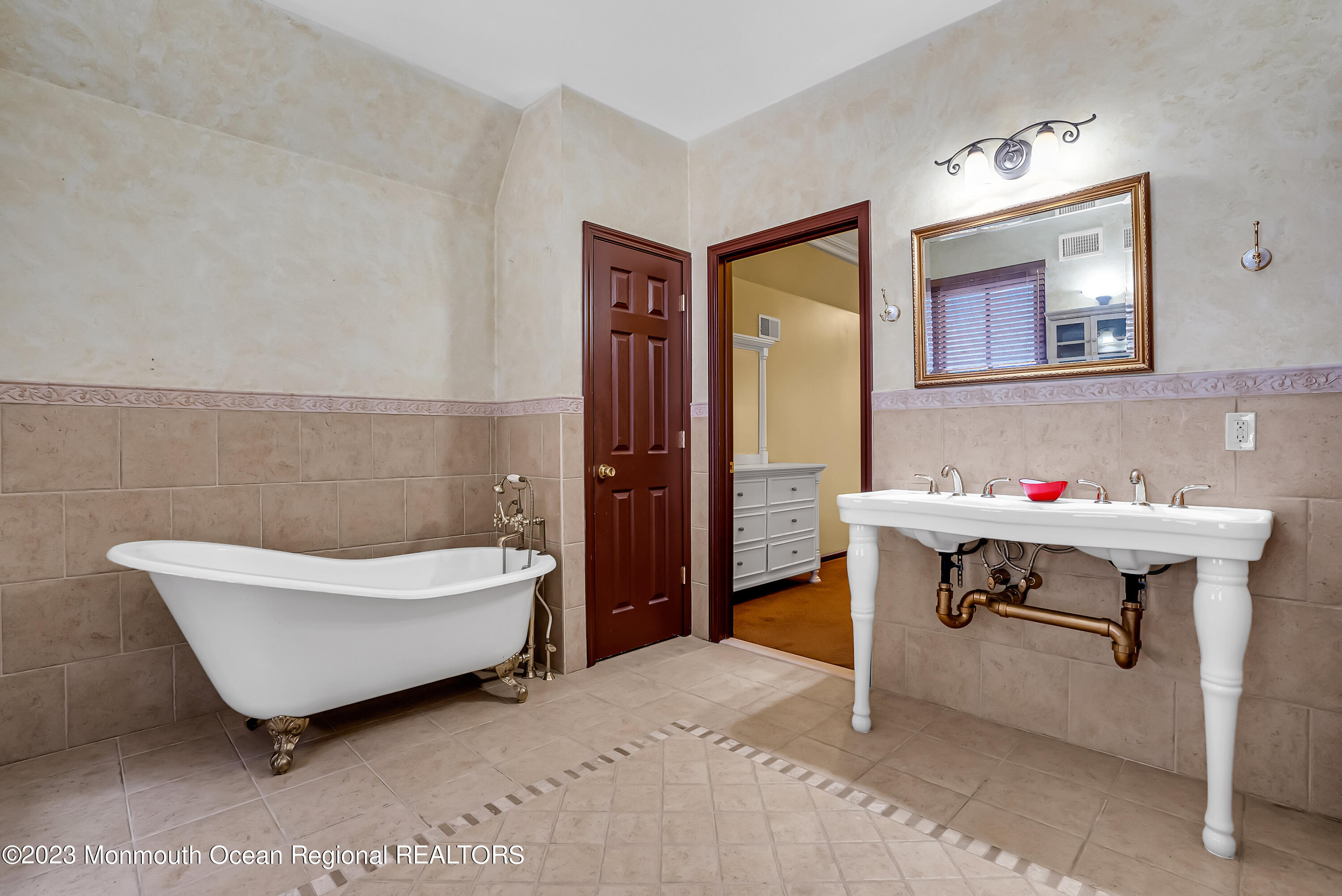 13 Pine Drive Millstone Township, NJ 08510 - Photo 37 of 56 a bathroom with a sink mirror and a bathtub