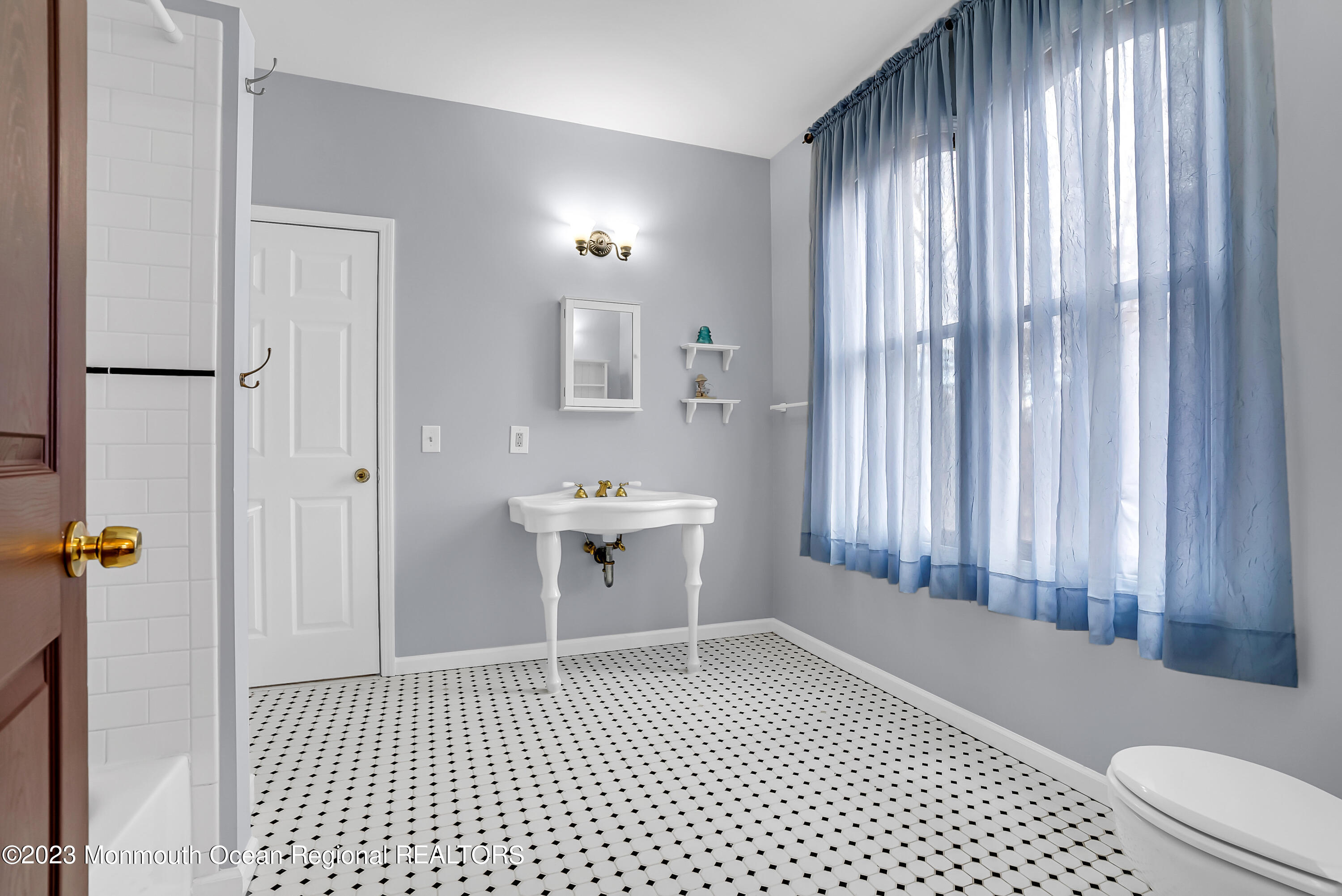 13 Pine Drive Millstone Township, NJ 08510 - Photo 40 of 56 a bathroom with a sink a toilet a window and shower