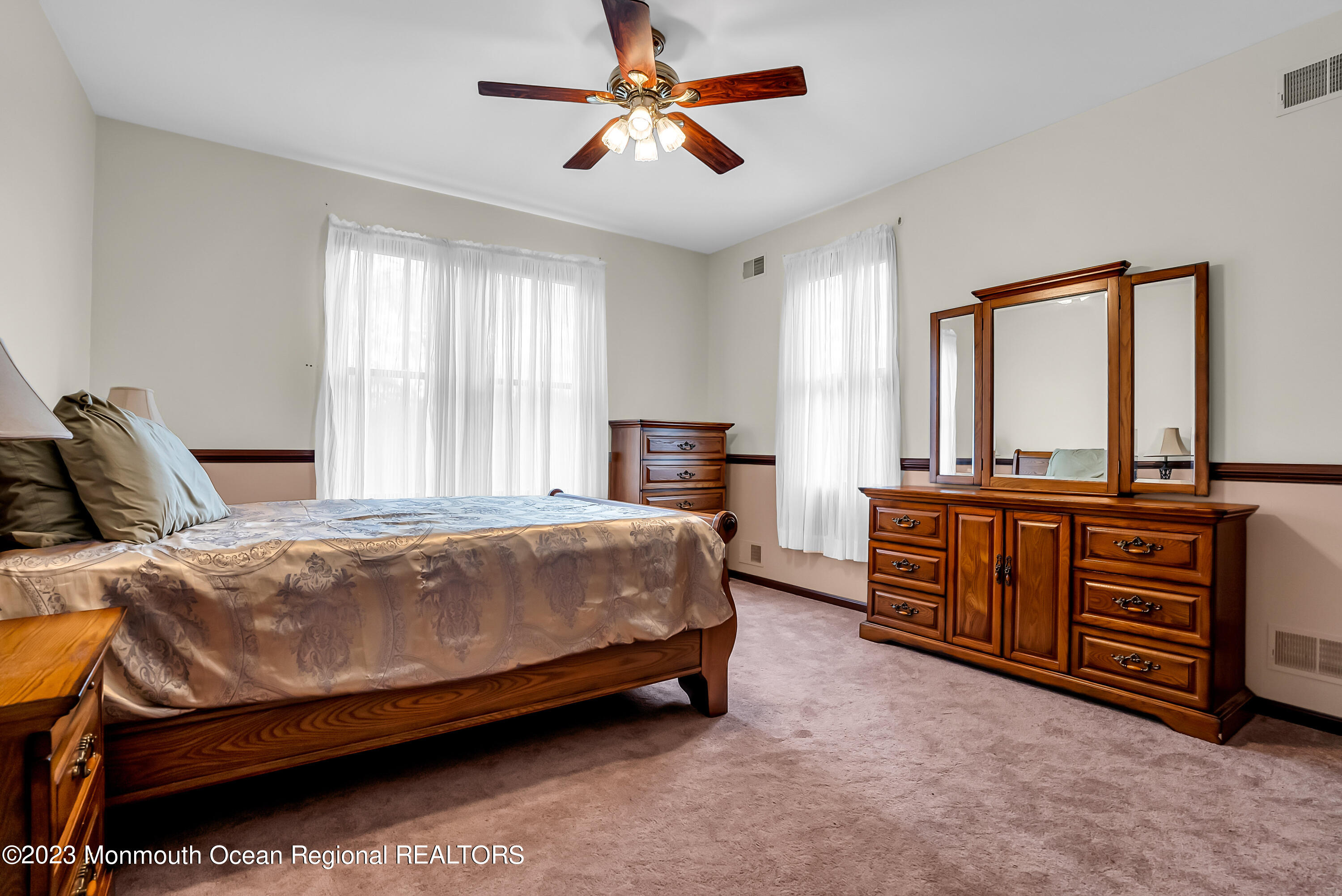 13 Pine Drive Millstone Township, NJ 08510 - Photo 41 of 56 a bedroom with a bed and dresser with mirror