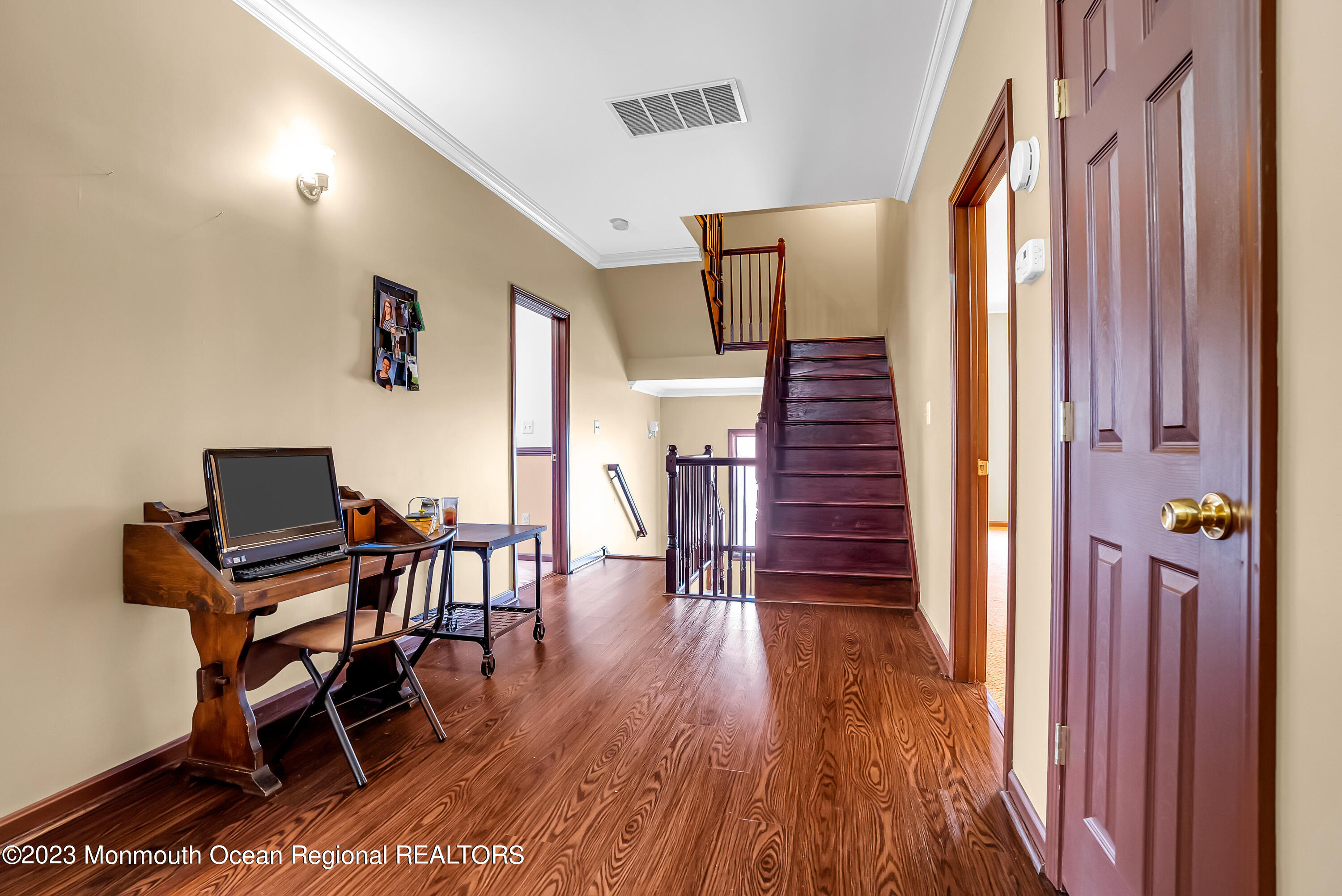 13 Pine Drive Millstone Township, NJ 08510 - Photo 43 of 56 a view of a hallway with wooden floor table and chairs