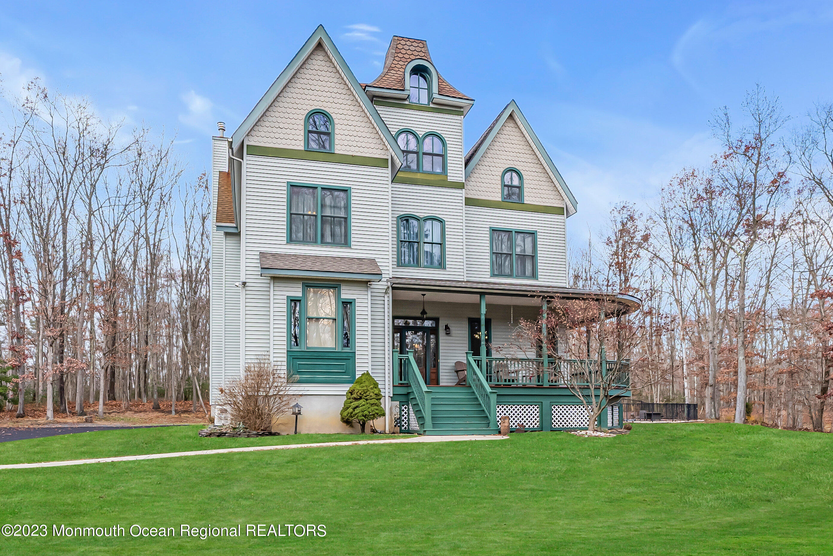 13 Pine Drive Millstone Township, NJ 08510 - Photo 10 of 56 a view of a brick house with a big yard and large trees