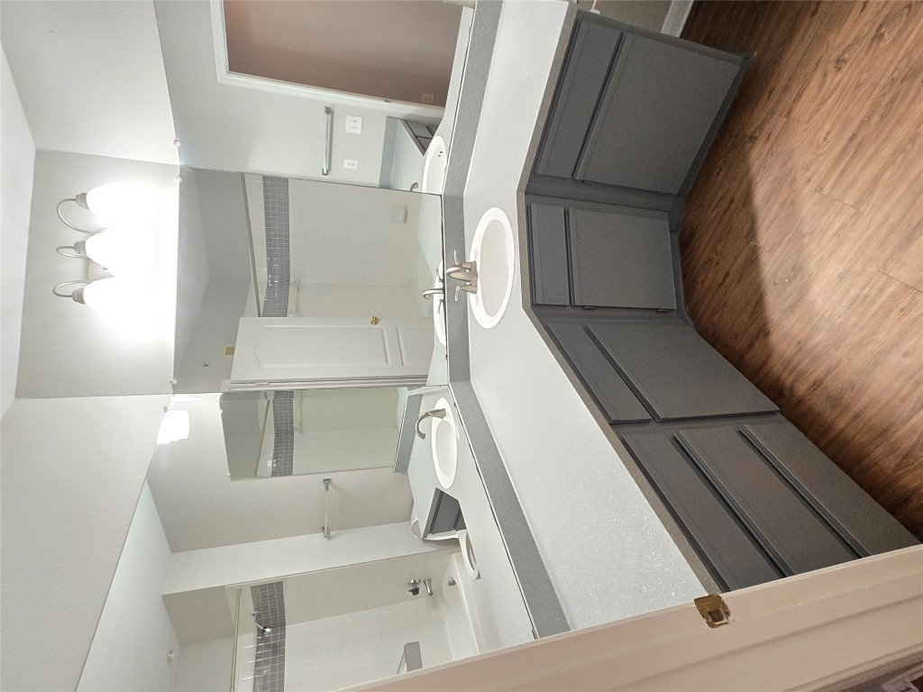6000 Shepherd Mountain Cove, Unit 1908 Austin, TX 78730 - Photo 14 of 24 a bathroom with a sink and a mirror