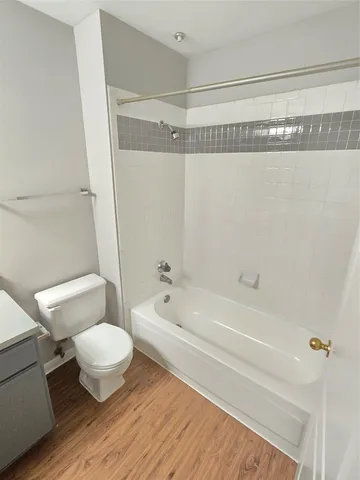 a bathroom with a toilet a sink and a bathtub