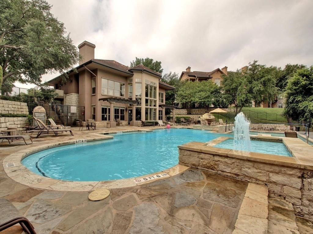 6000 Shepherd Mountain Cove, Unit 1908 Austin, TX 78730 - Photo 19 of 24 a view of a house with pool and chairs