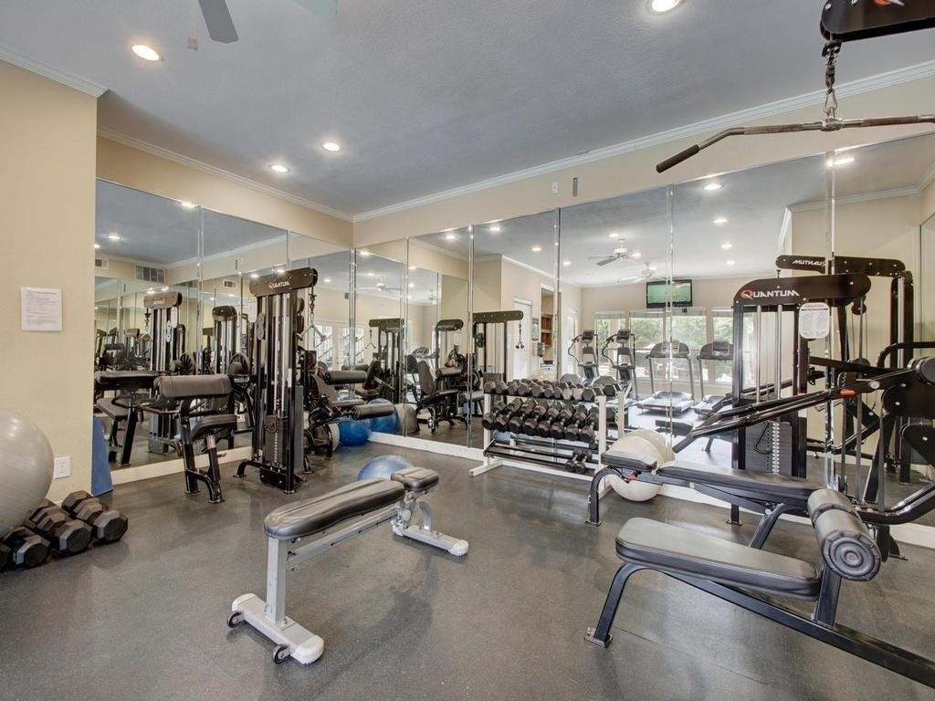 6000 Shepherd Mountain Cove, Unit 1908 Austin, TX 78730 - Photo 20 of 24 a view of a room with gym equipment