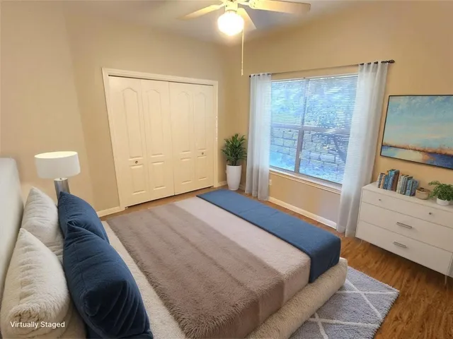 a bed room with a bed and a window