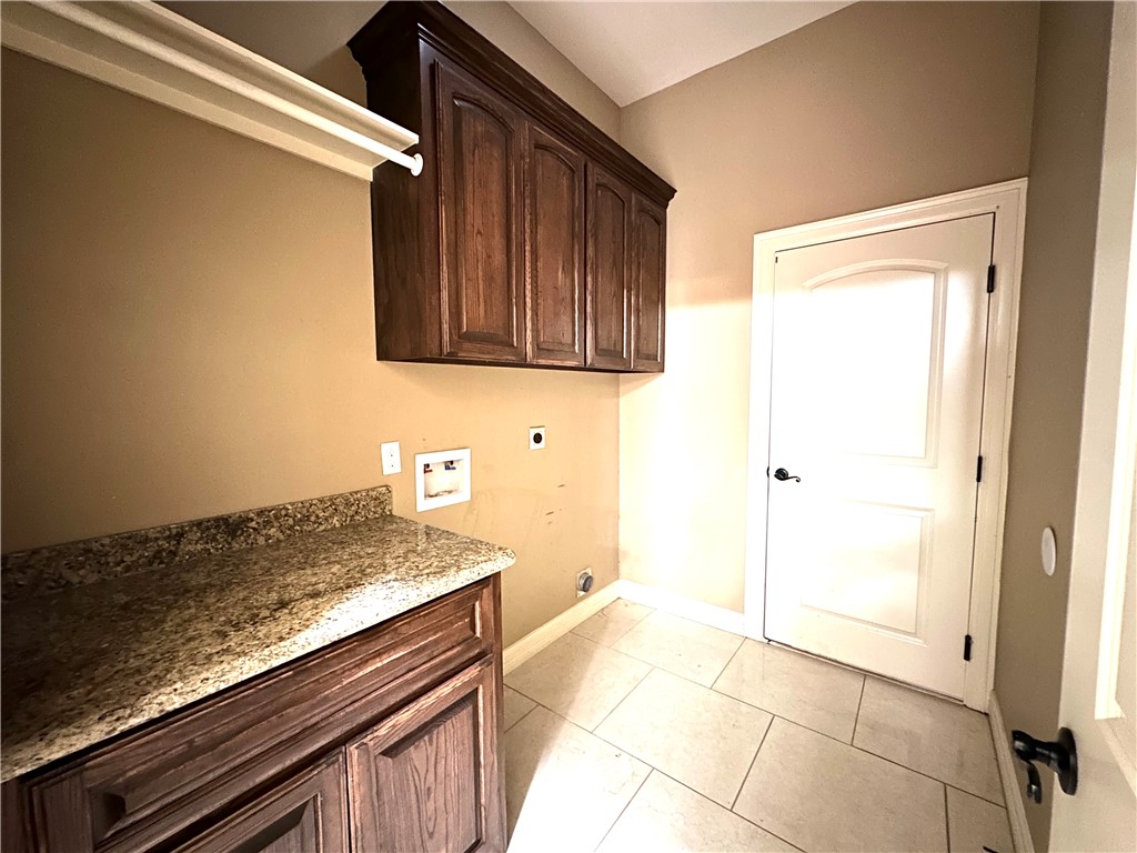1503 Lewis Street Kingsville, TX 78363 - Photo 12 of 30 a view of kitchen with granite countertop cabinets and black appliances