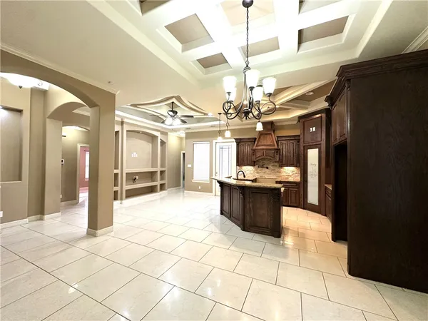 a large room with lots of appliances and cabinets