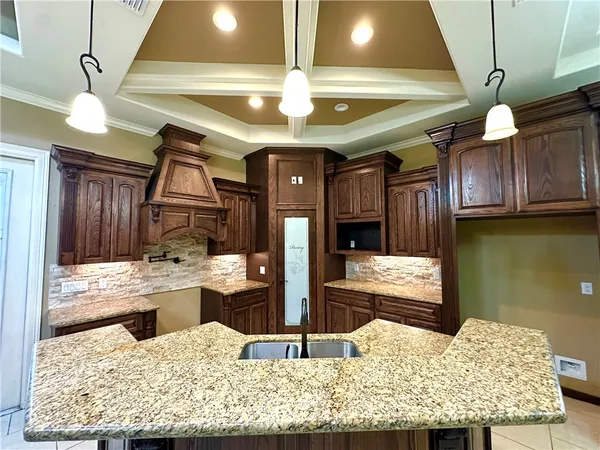 a view of a living room and kitchen