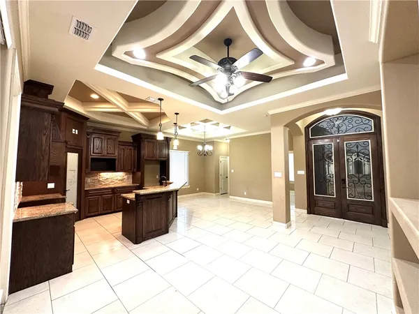 a view of entryway and kitchen