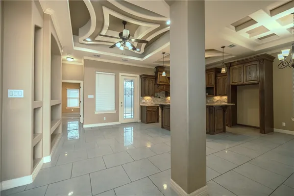 a view of a hallway with wooden shelves