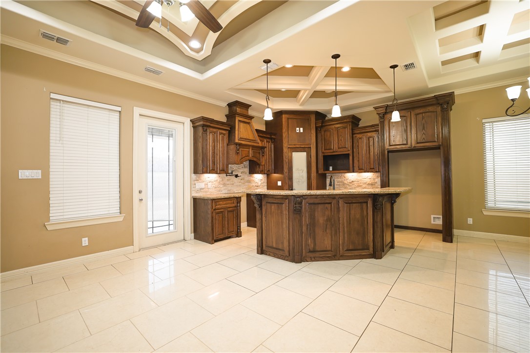 1503 Lewis Street Kingsville, TX 78363 - Photo 6 of 30 a view of a kitchen with a sink