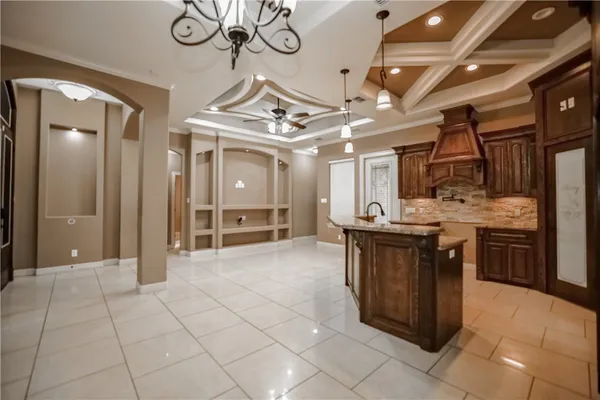 a kitchen with stainless steel appliances granite countertop a sink and cabinets
