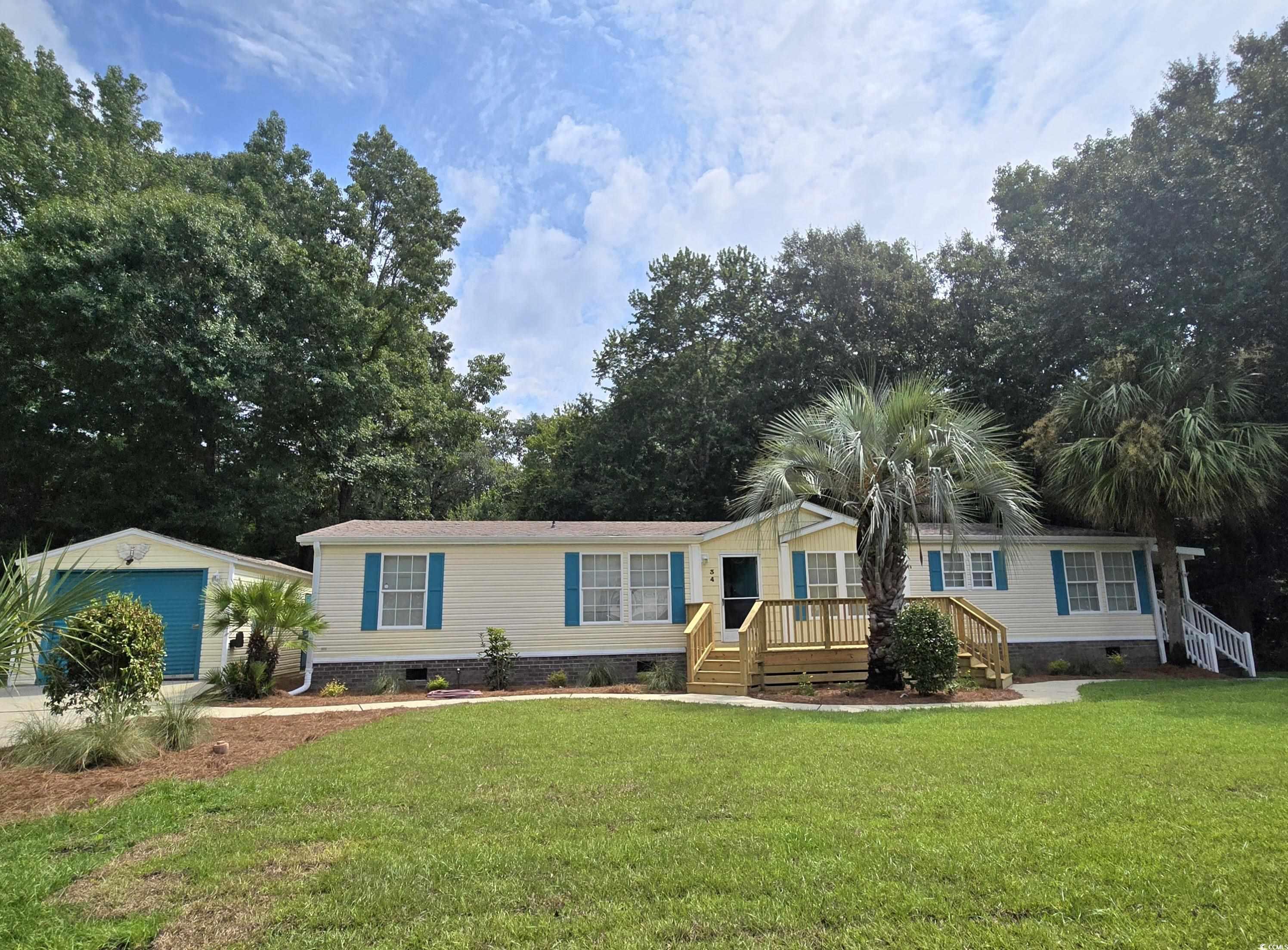 34 Talon Circle Murrells Inlet, SC 29576 - Photo 2 of 40 Manufactured / mobile home featuring crawl space and a front yard