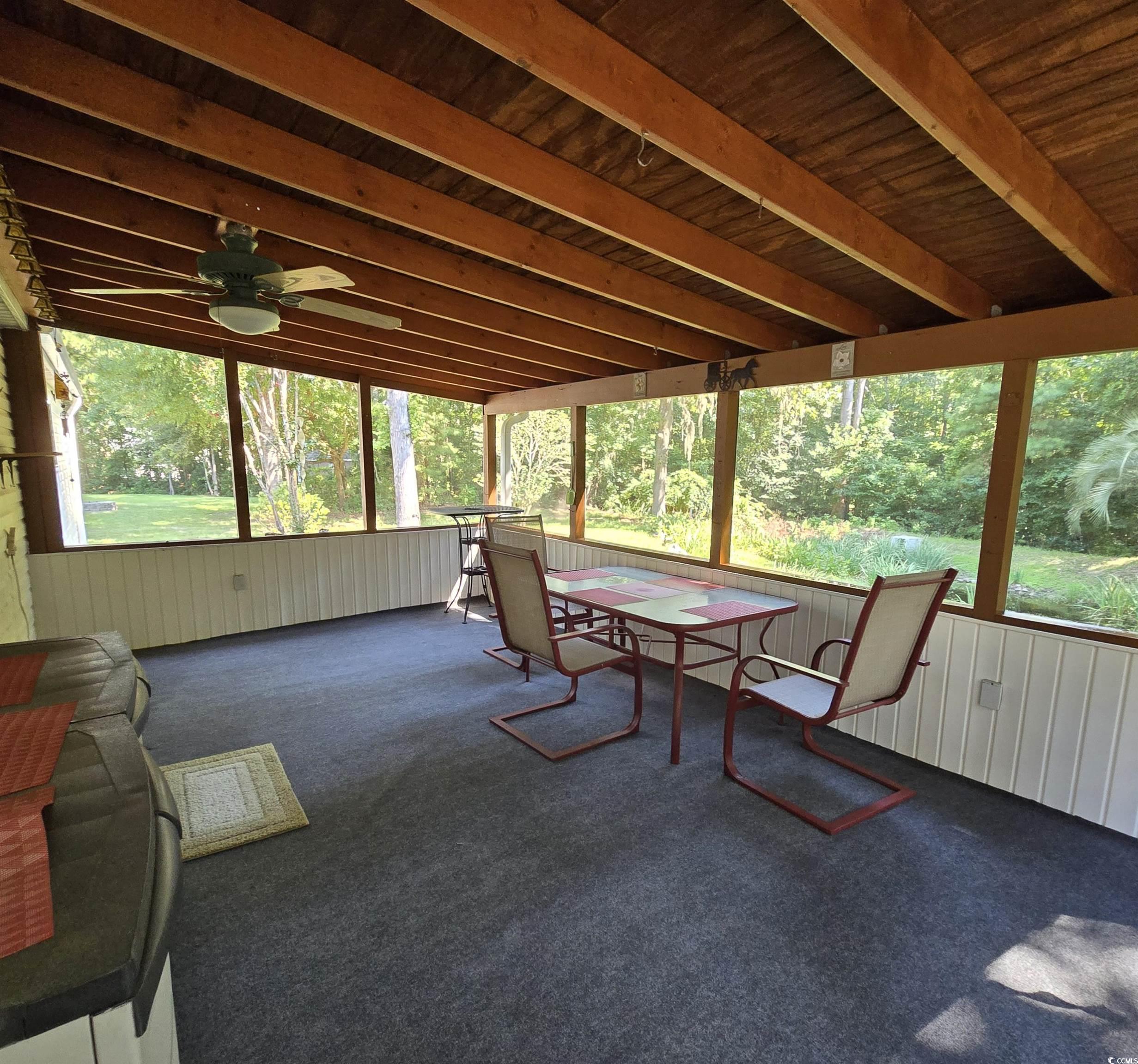 34 Talon Circle Murrells Inlet, SC 29576 - Photo 32 of 40 Sunroom / solarium with healthy amount of natural light, outdoor dining area, and a ceiling fan