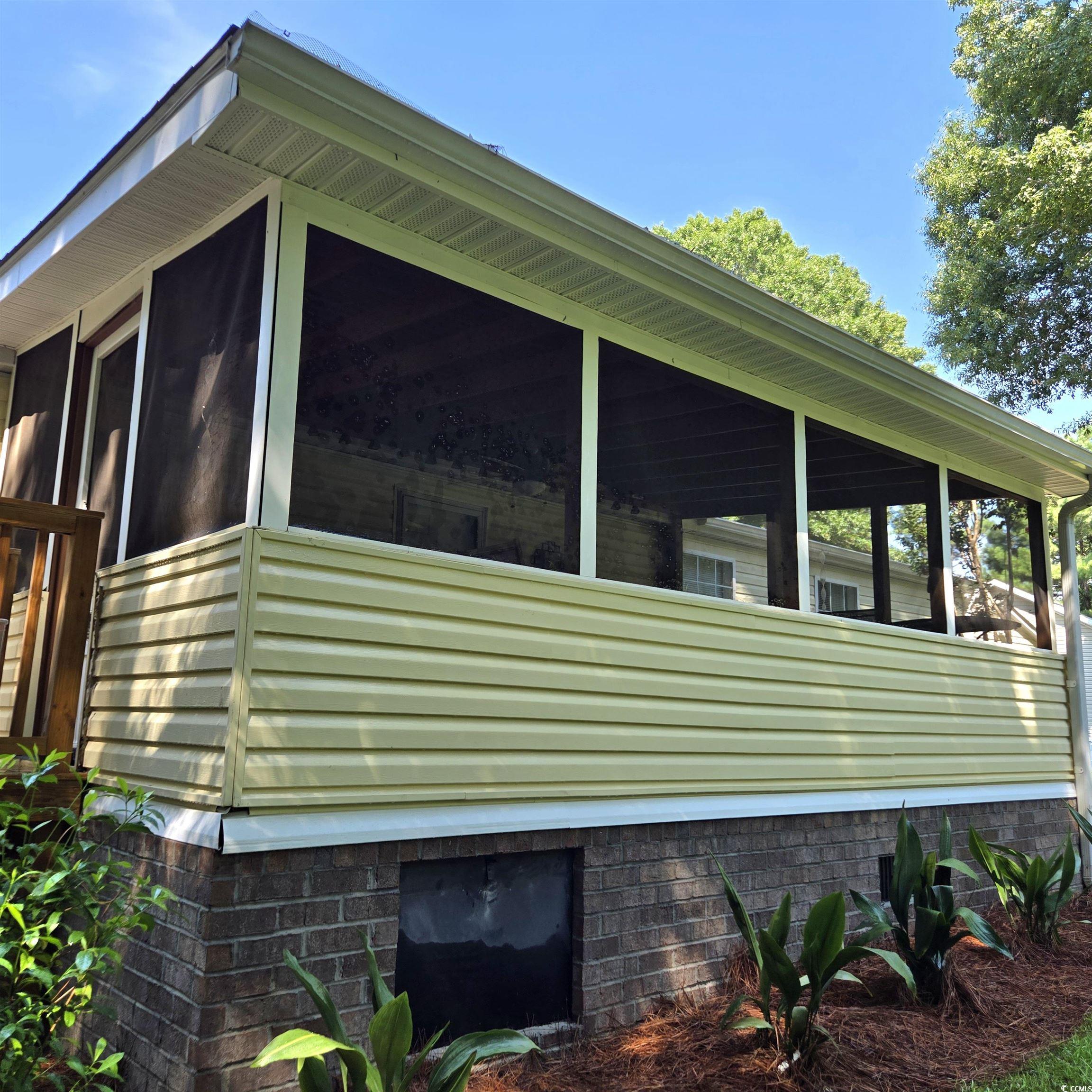 34 Talon Circle Murrells Inlet, SC 29576 - Photo 34 of 40 View of home's exterior with a sunroom