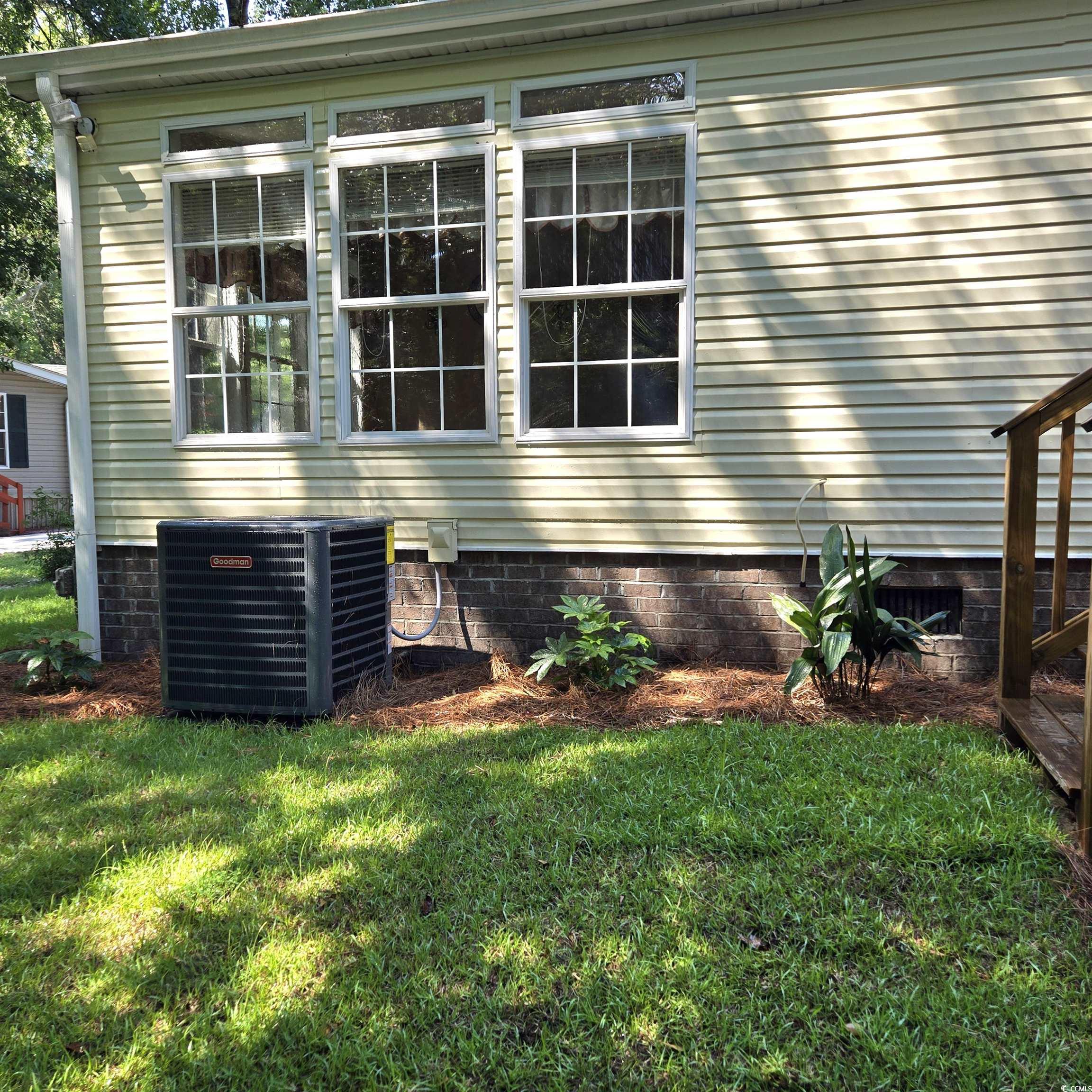 34 Talon Circle Murrells Inlet, SC 29576 - Photo 35 of 40 View of property exterior with a yard and crawl space