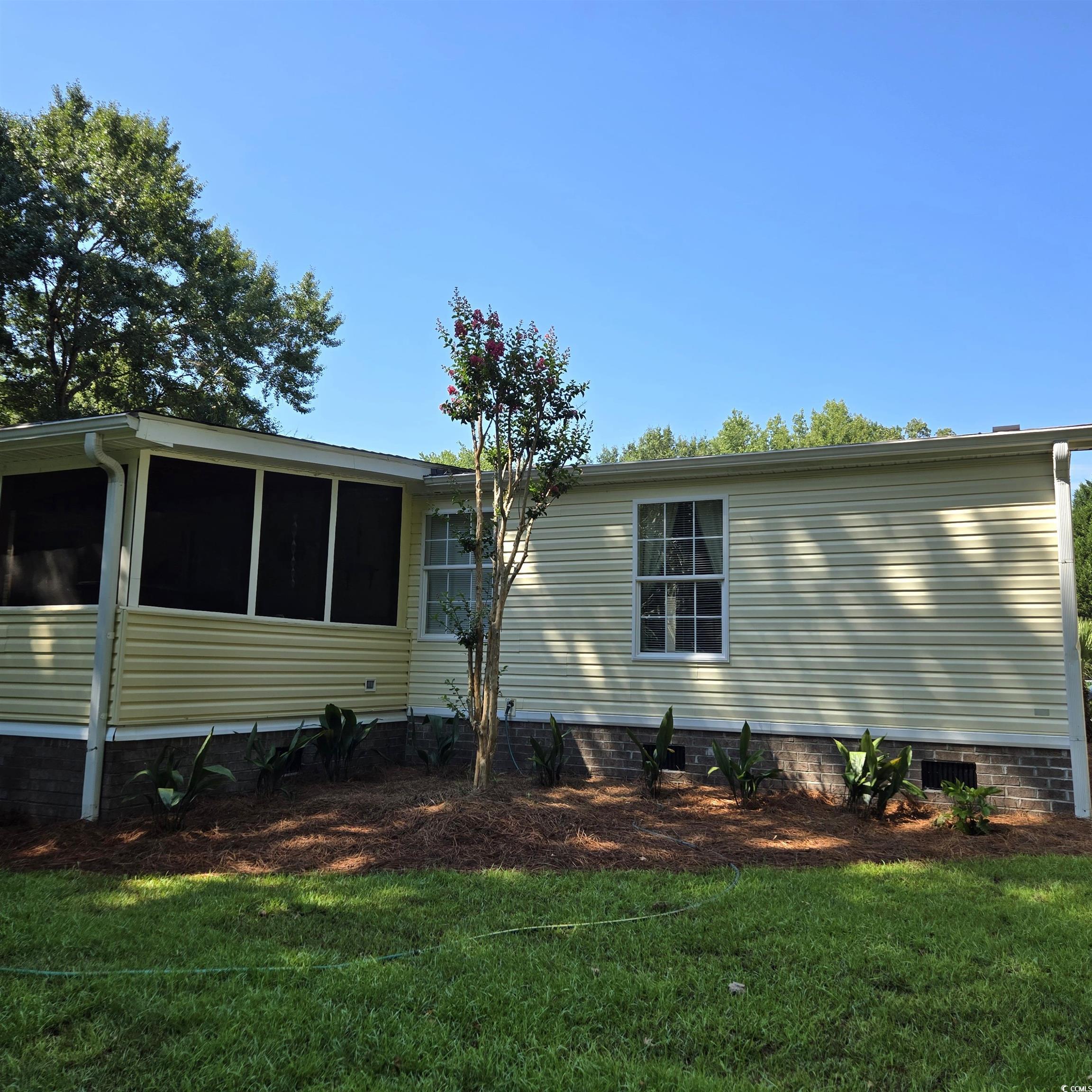 34 Talon Circle Murrells Inlet, SC 29576 - Photo 36 of 40 View of home's exterior featuring a yard, a sunroom, and crawl space