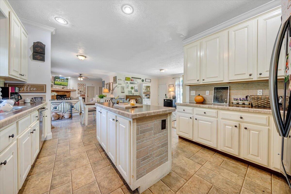 4315 Bandy Road Roanoke, VA 24014 - Photo 12 of 31 a kitchen with kitchen island granite countertop lots of white stainless steel appliances cabinets and a sink