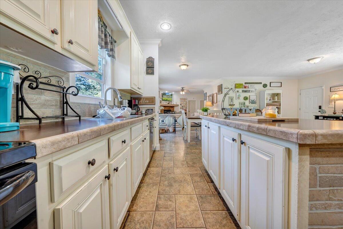 4315 Bandy Road Roanoke, VA 24014 - Photo 13 of 31 a kitchen with stainless steel appliances a sink stove and cabinets