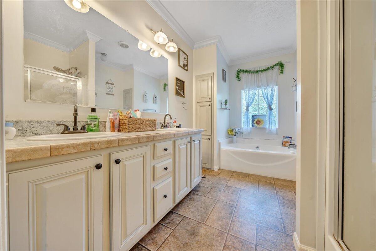 4315 Bandy Road Roanoke, VA 24014 - Photo 15 of 31 a spacious bathroom with a double vanity sink a mirror a bathtub and shower