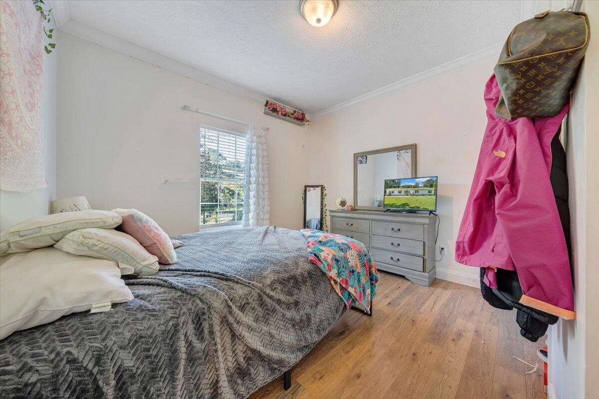 4315 Bandy Road Roanoke, VA 24014 - Photo 21 of 31 a bedroom with a bed a dresser and chair