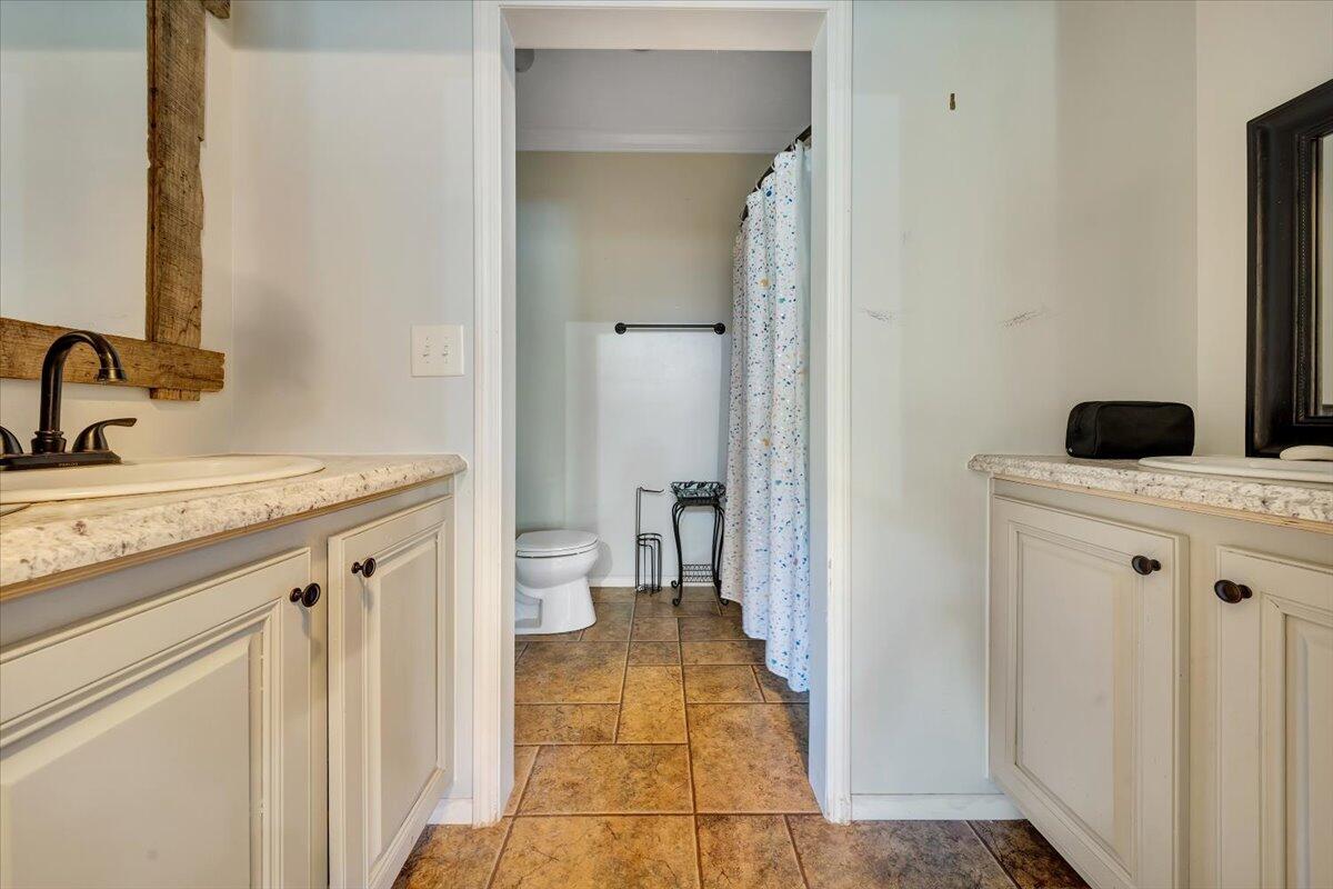 4315 Bandy Road Roanoke, VA 24014 - Photo 24 of 31 a bathroom with a sink a toilet and shower