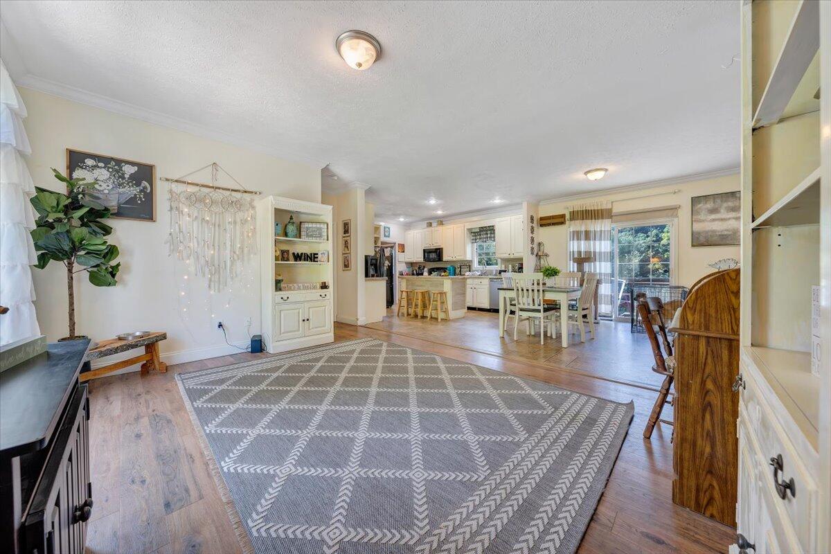 4315 Bandy Road Roanoke, VA 24014 - Photo 5 of 31 a living room with furniture a wooden floor and next to dining room
