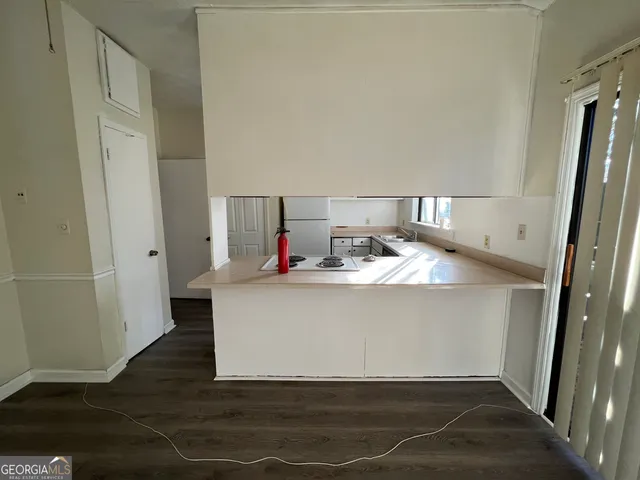 an empty room with a empty space and window