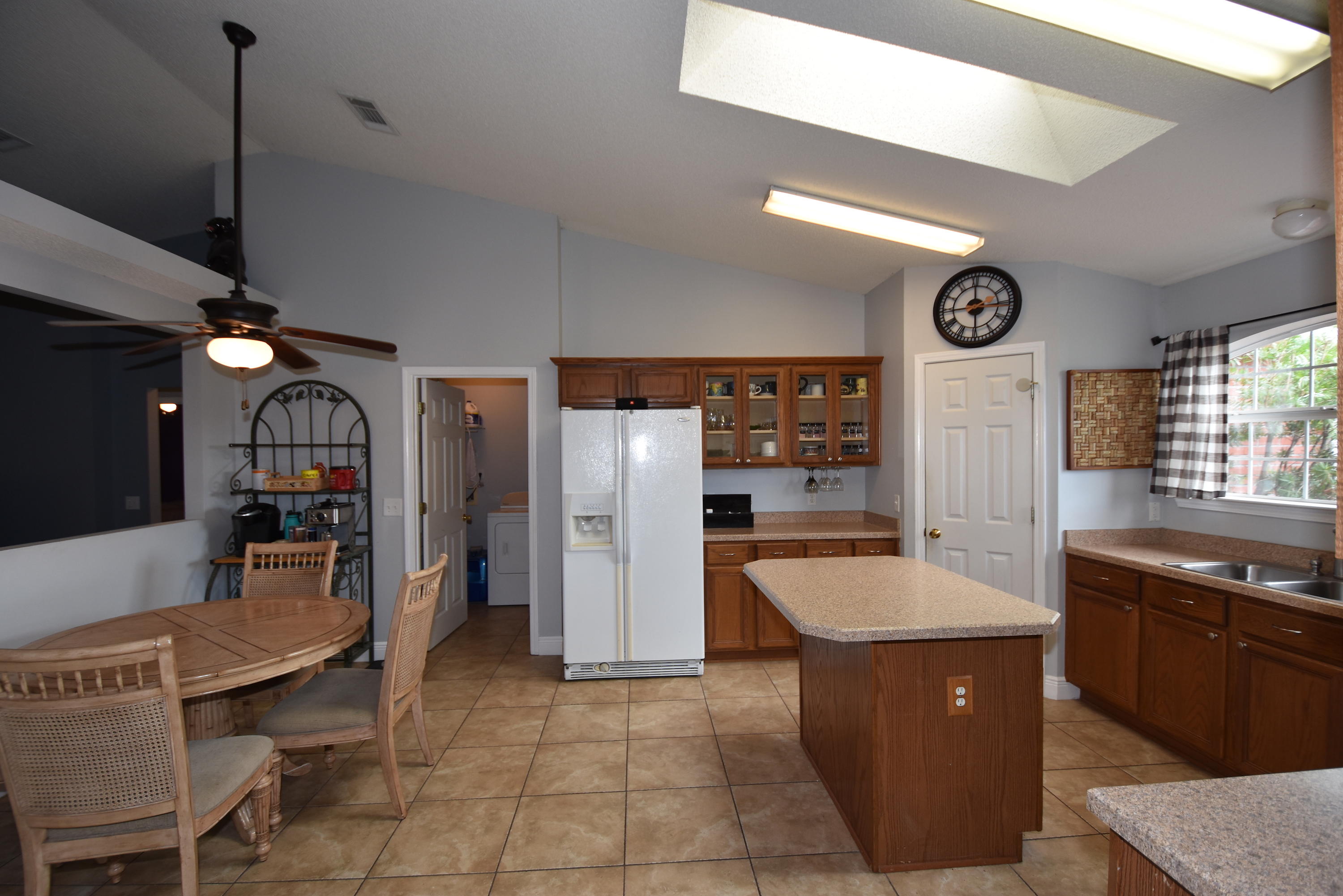 1222 Northview Drive Crestview, FL 32536 - Photo 11 of 36 a large kitchen with stainless steel appliances granite countertop a sink and a refrigerator