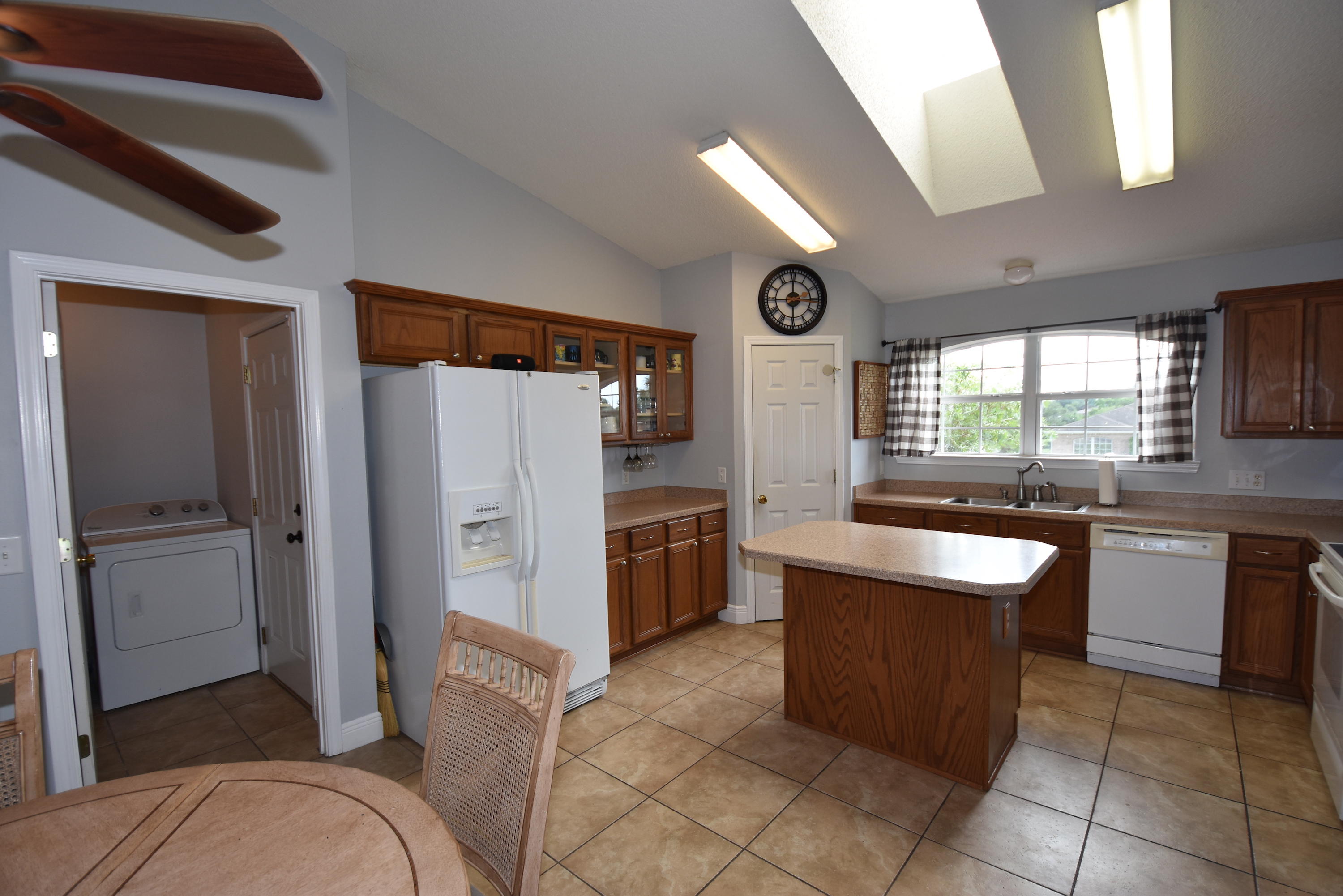 1222 Northview Drive Crestview, FL 32536 - Photo 12 of 36 a kitchen with a refrigerator and a sink